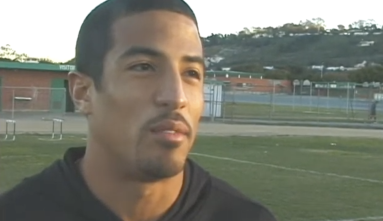 Eric Morton with football field behind him